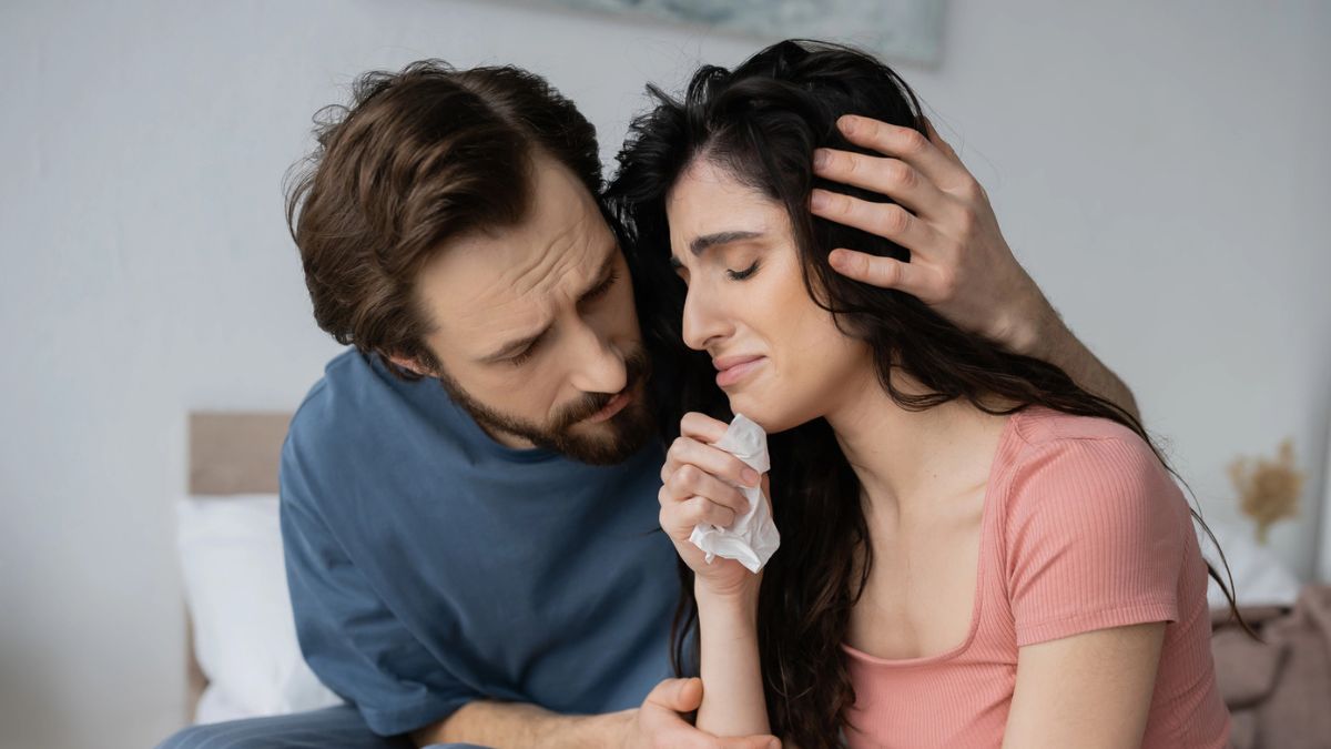 couple crying in pajamas