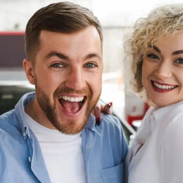 couple excited buying a car