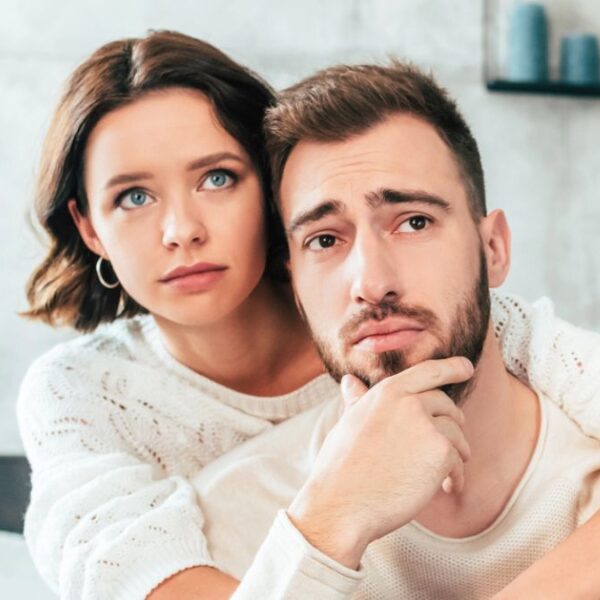 couple sad hugging together