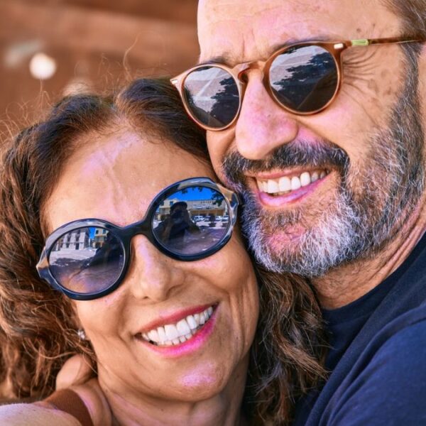 couple smiling with glasses