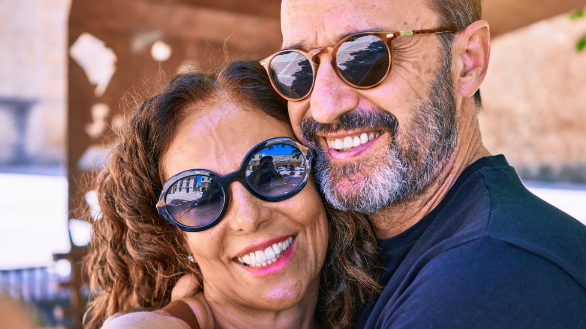 couple smiling with glasses