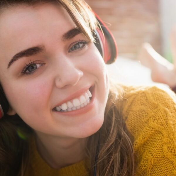 girl wearing headphones smiling