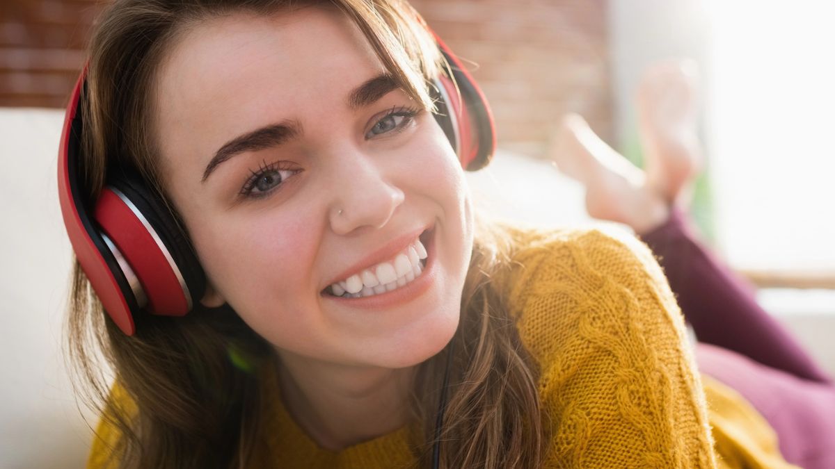 girl wearing headphones smiling