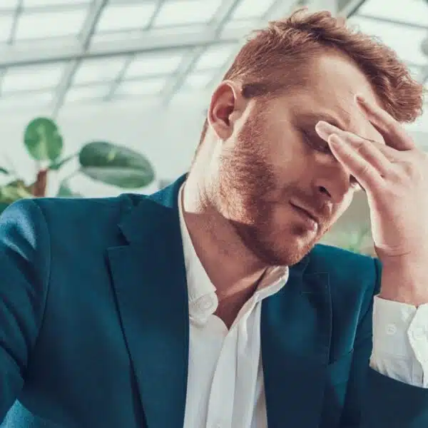 man suit stress desk