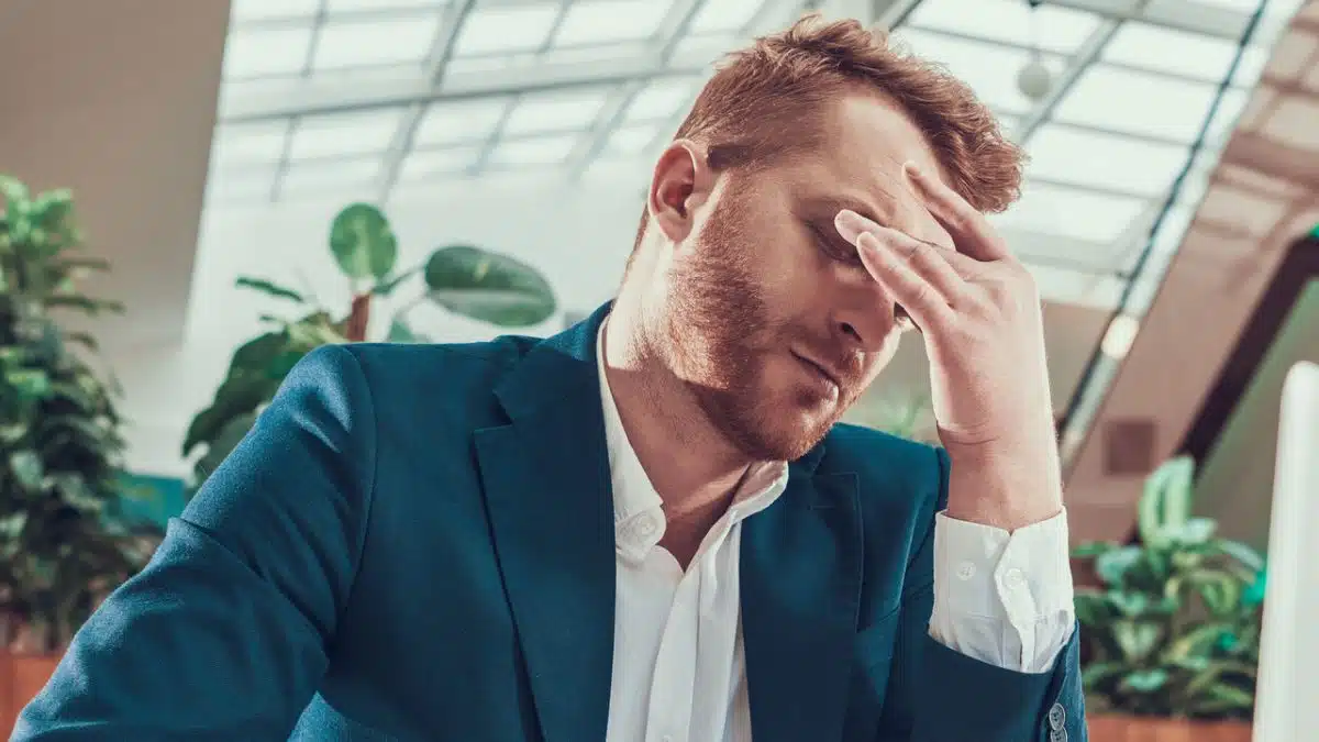 man suit stress desk