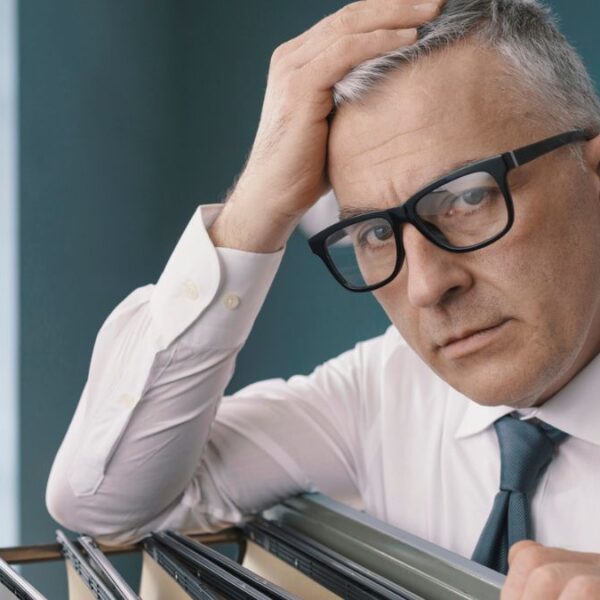 man with files glasses