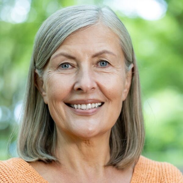 mature woman standing in the garden