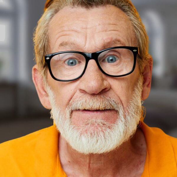 older man with a beard stunned
