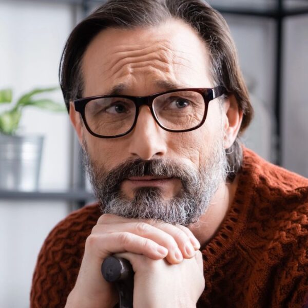 senior man cane glasses