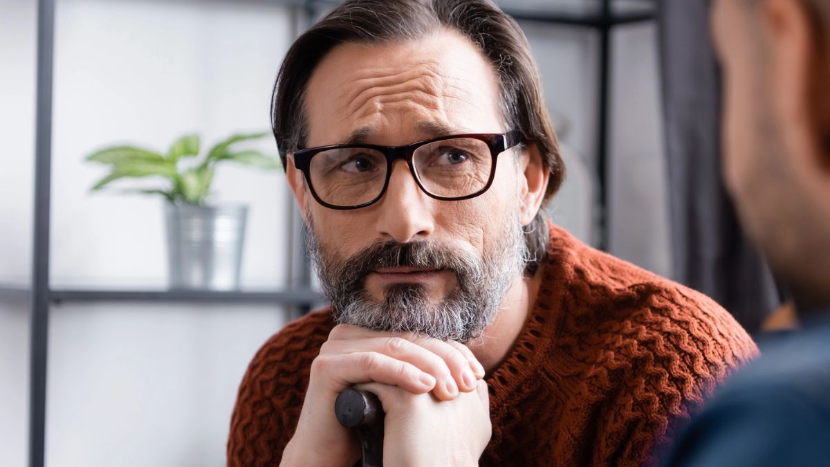 senior man cane glasses
