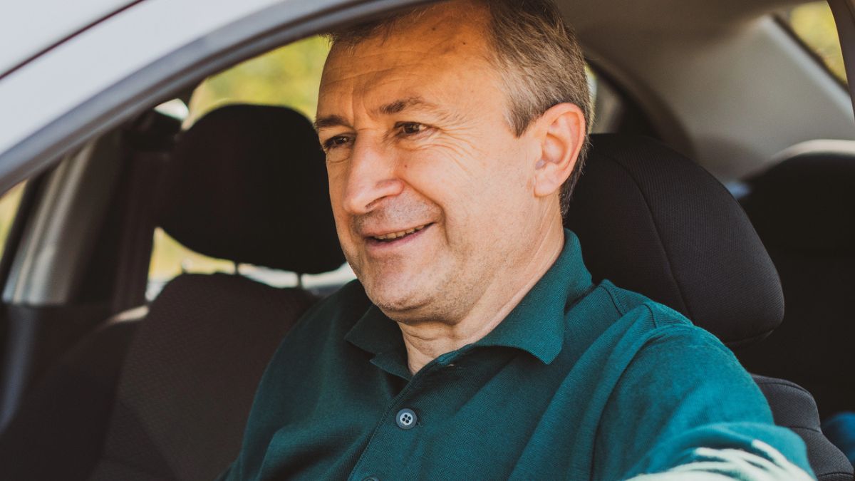 senior man driving a car