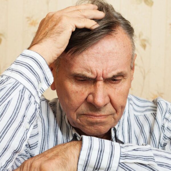 senior man worried on a chair