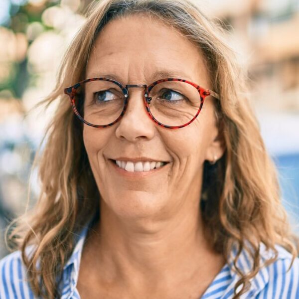 senior woman glasses smiling outside