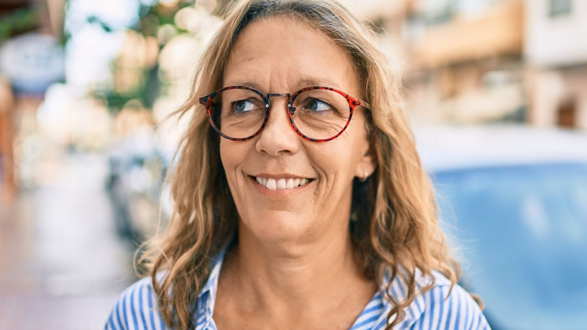 senior woman glasses smiling outside