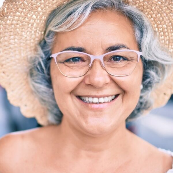 senior woman smiling with a hat