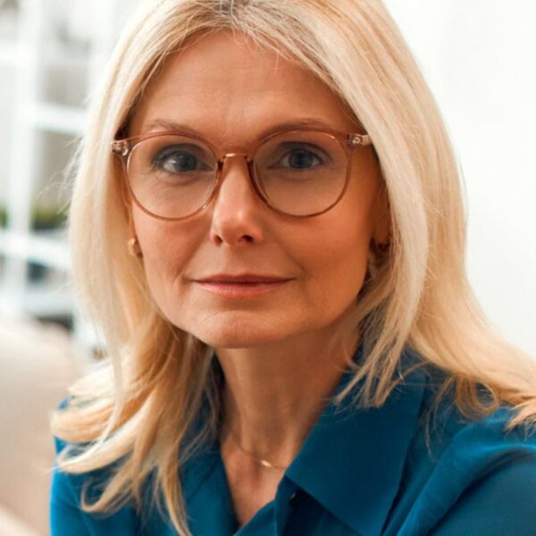 senior woman with glasses couch