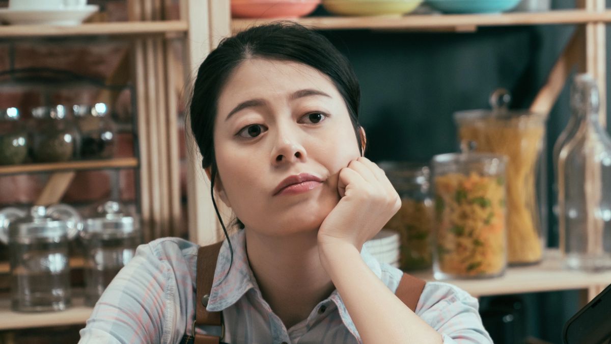 woman barista sad tired