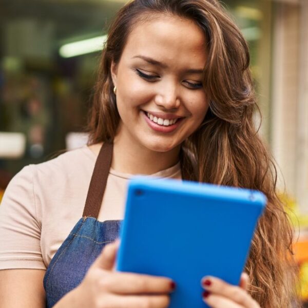 woman barista with tablet