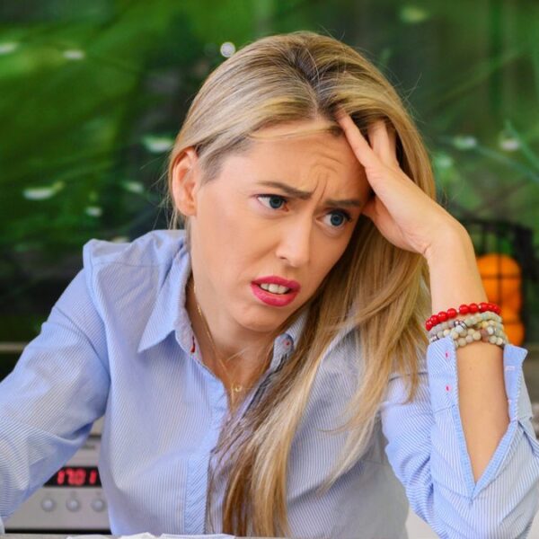 woman bills worried laptop