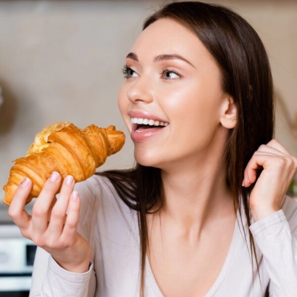 woman breakfast croissant