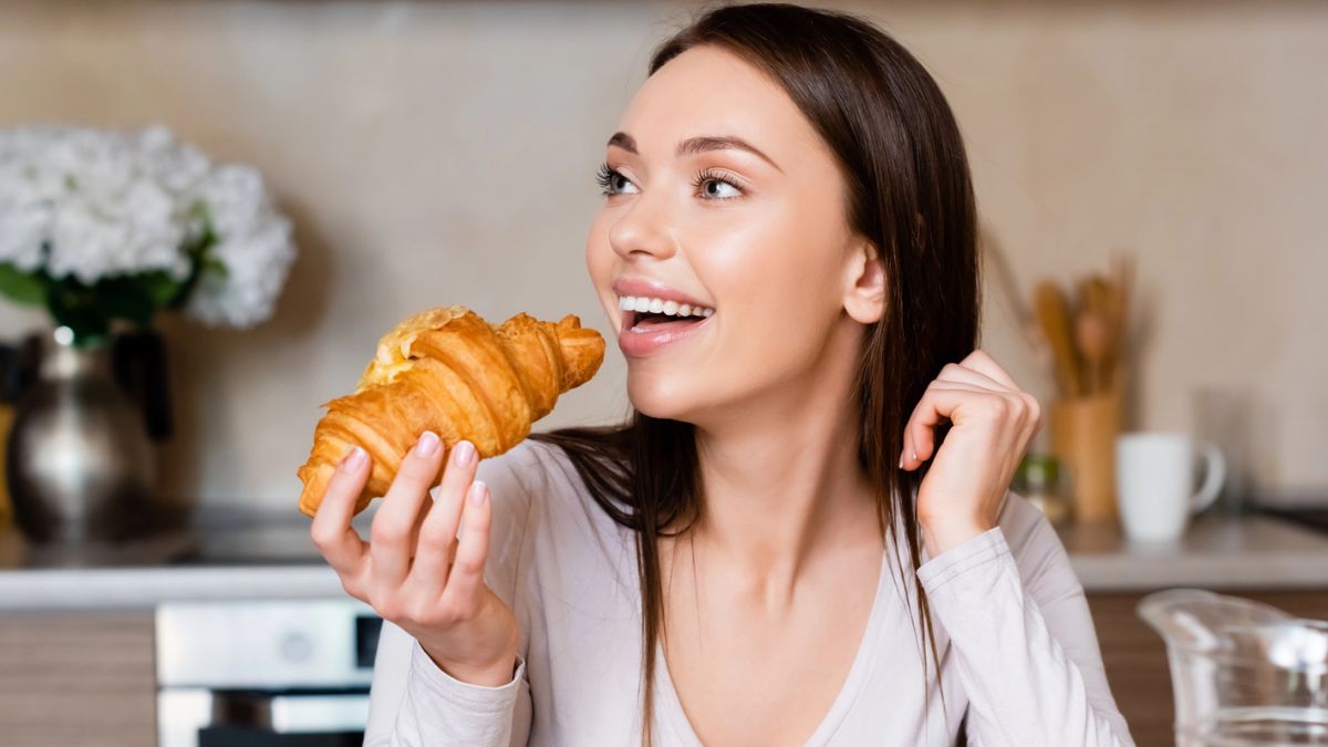woman breakfast croissant