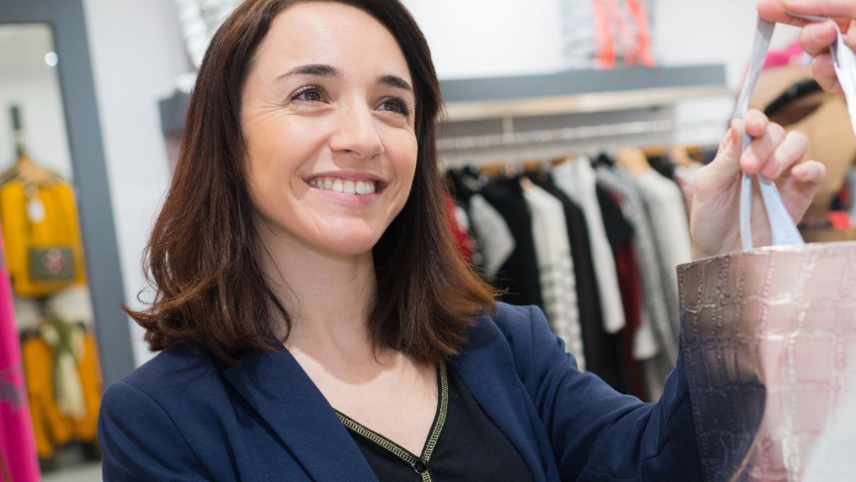 woman buying something at a store
