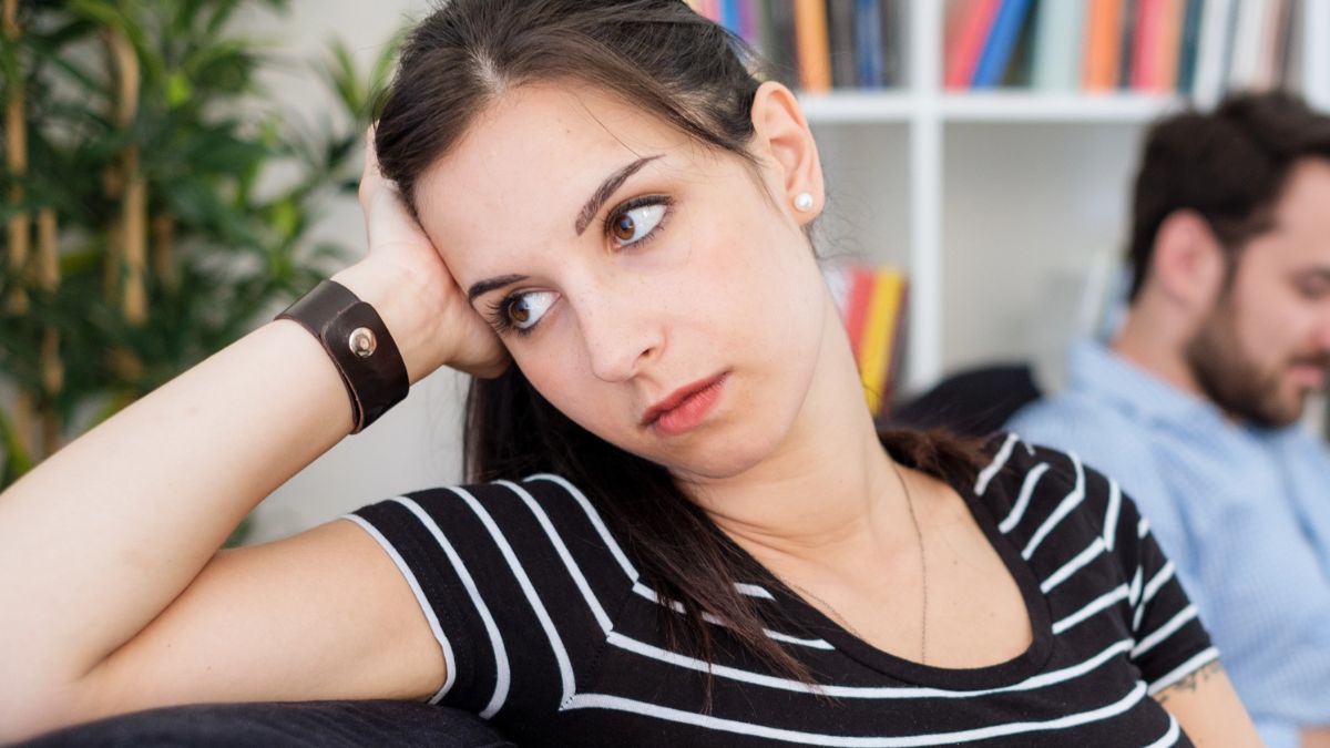 woman feeling lonely on the couch