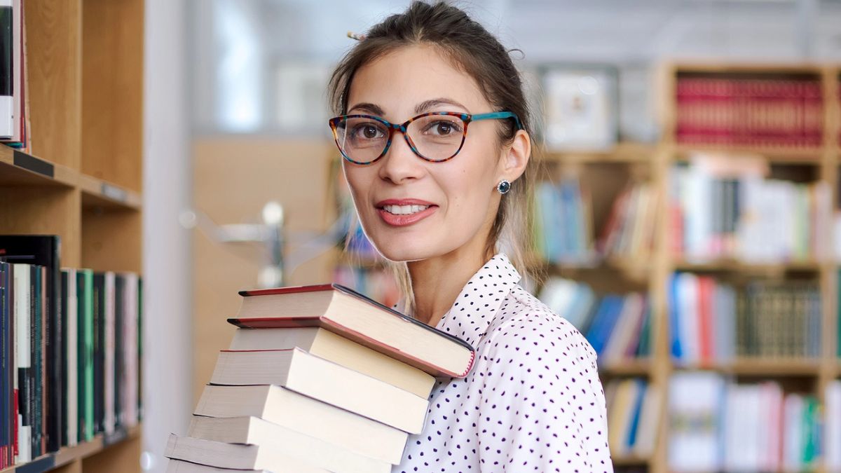 woman holding books