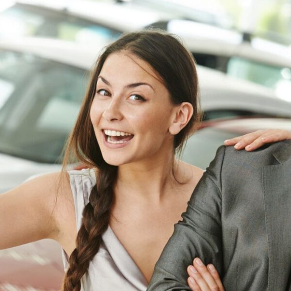 woman holing up car keys