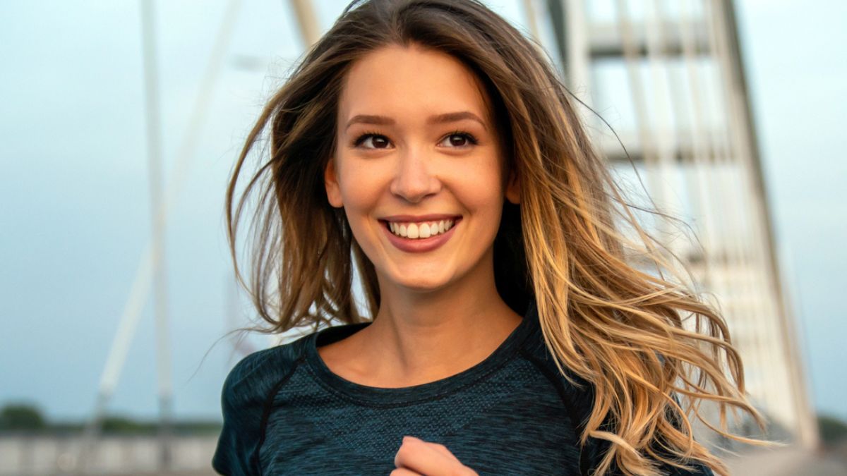 woman jogging on the bridge
