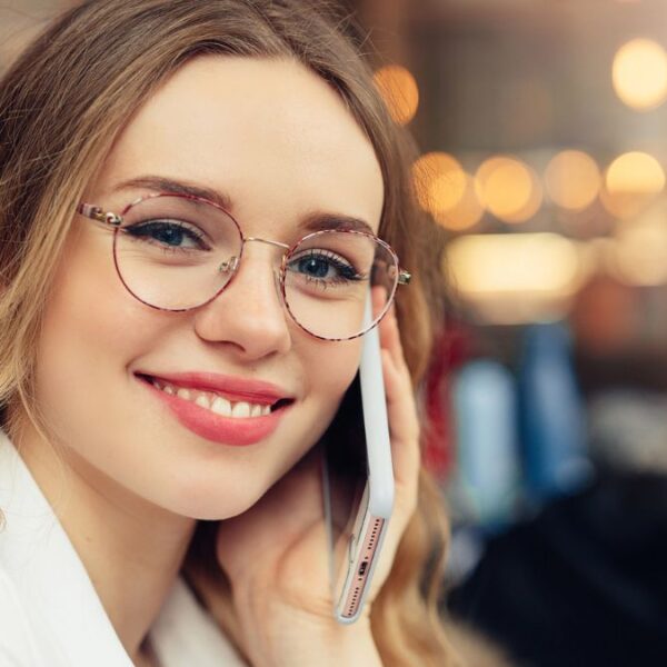 woman on the phone glasses talking