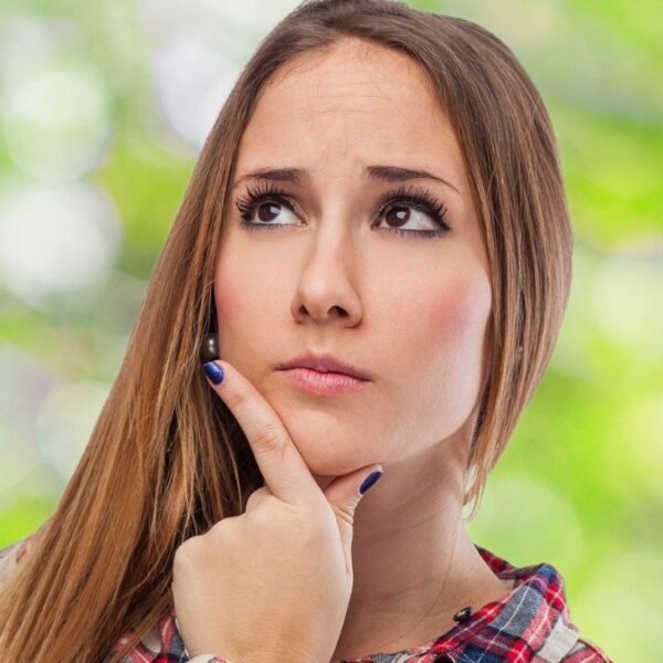 woman outside thinking to herserlf