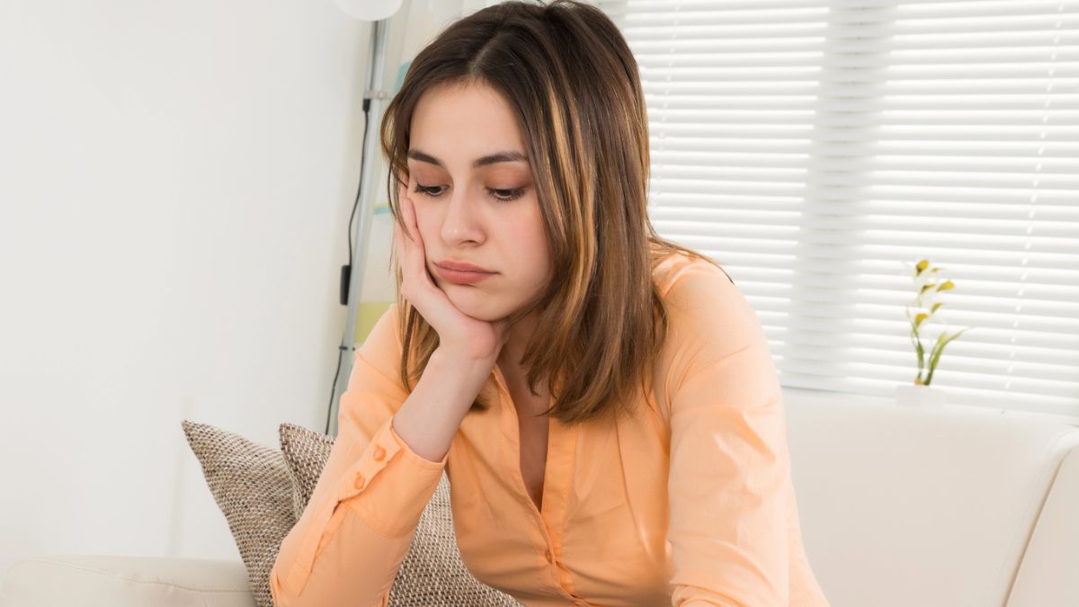 woman sad at her money