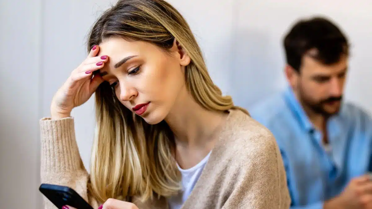woman sad over her phone
