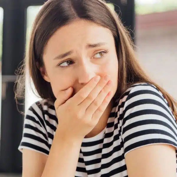 woman shock covering her mouth