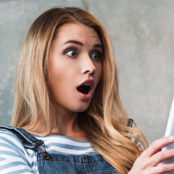 woman shocked at the tablet