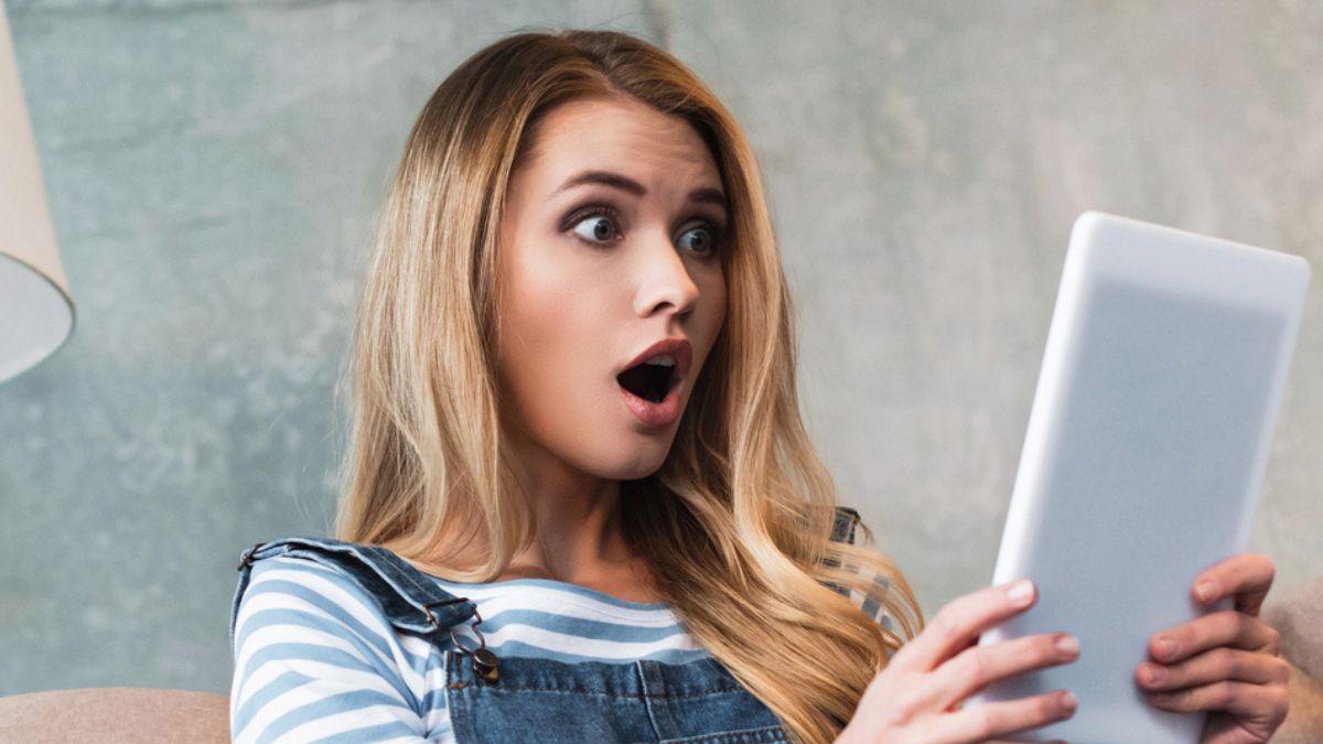 woman shocked at the tablet