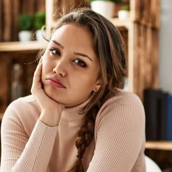 woman sitting leaning on the kitchen counter
