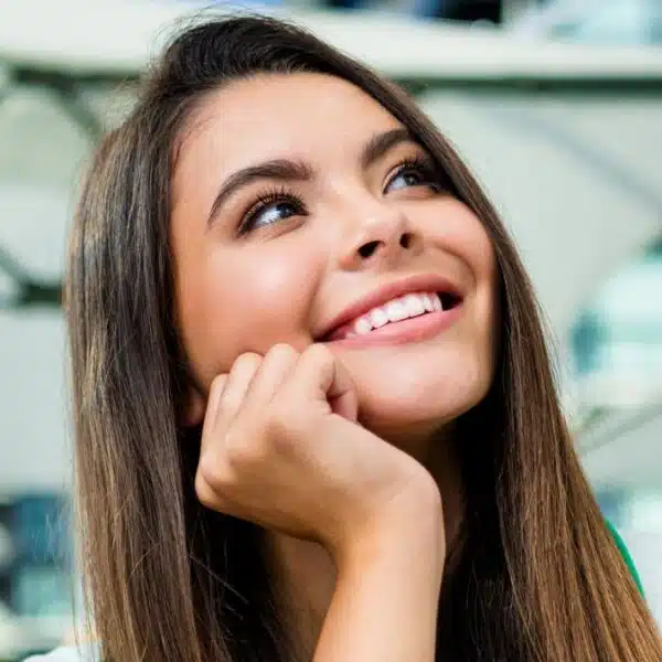 woman smiling outside under tarp