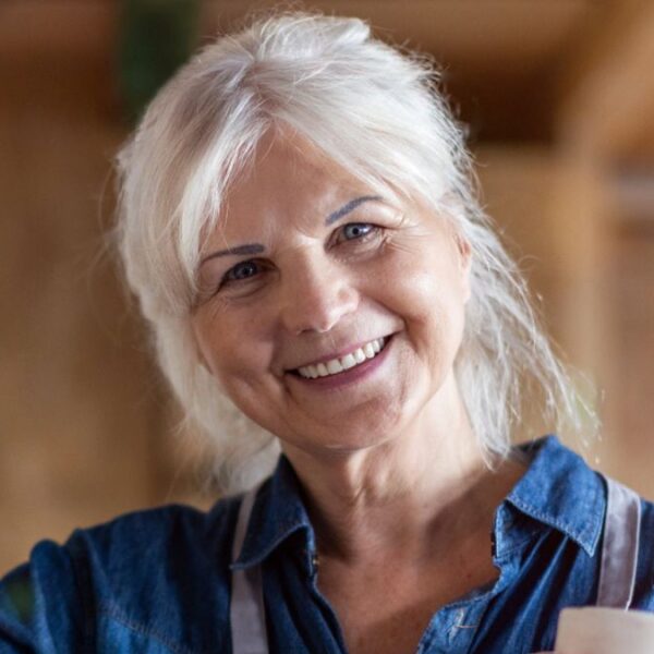 woman smiling with pottery