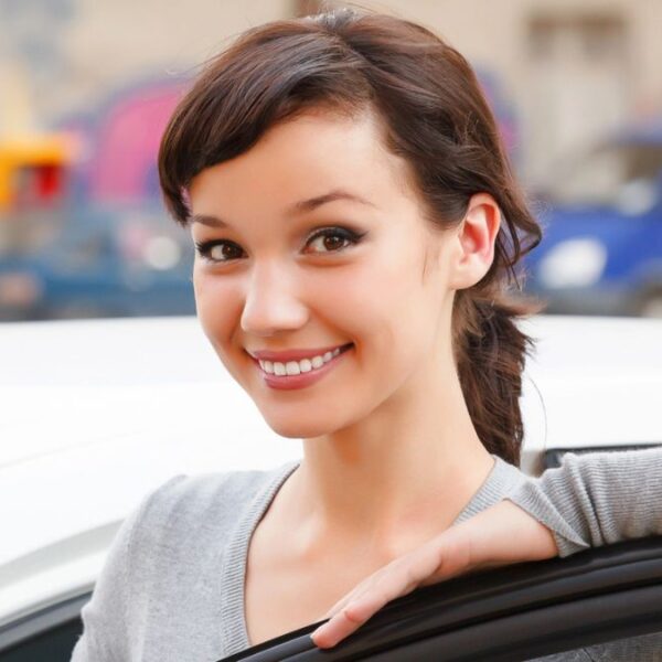 woman standing next to a car