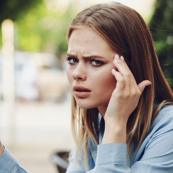 woman stressed looking at her phone