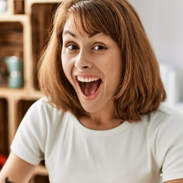 woman surprised looking at wallet