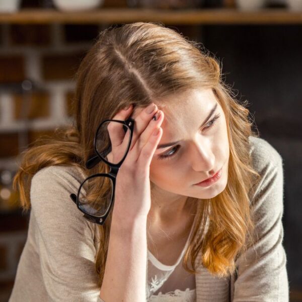 woman upset in front of her laptop