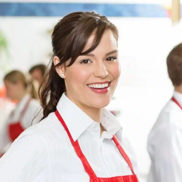 woman wearing a red apron