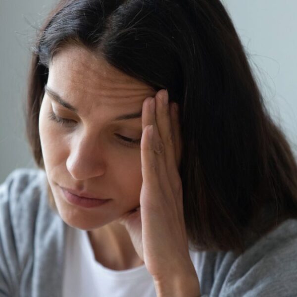 woman worried at couch