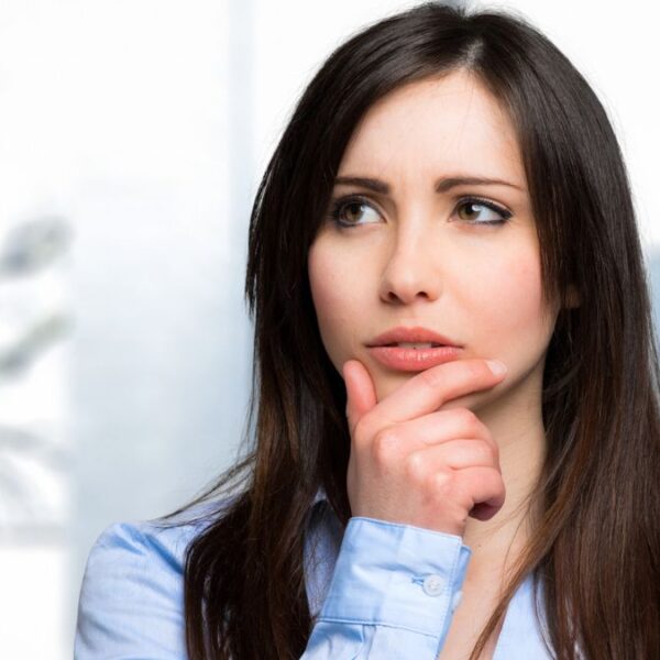 brunette thinking to herself