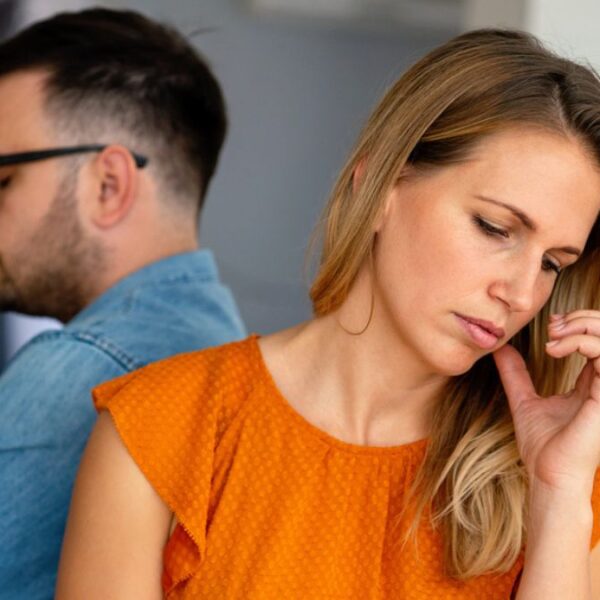 couple sitting back to back