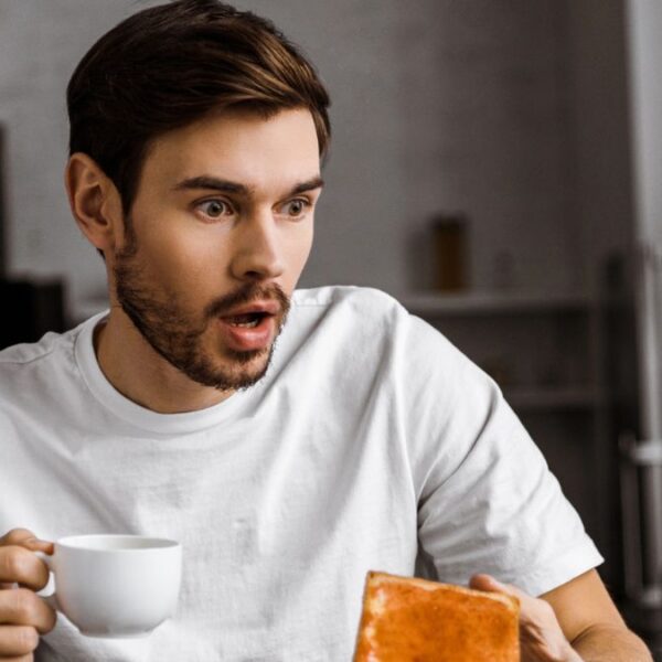 man drinking coffee toast