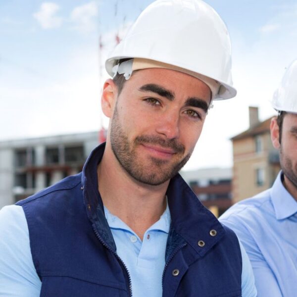 man hard at engineer blueprints